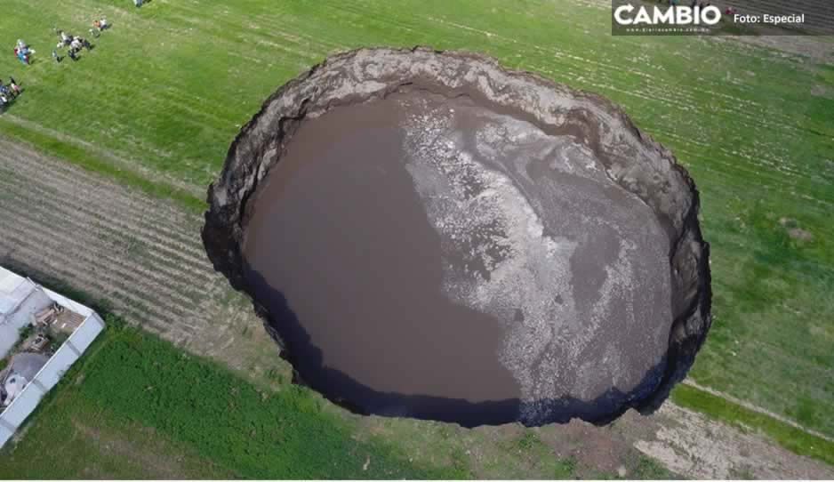 Indemnizan a 13 productores que perdieron sus tierras con el socavón de Puebla